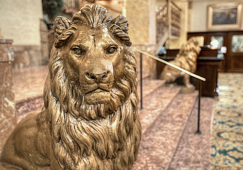 Gold statue of a lion in the lobby of the Pfister Hotel